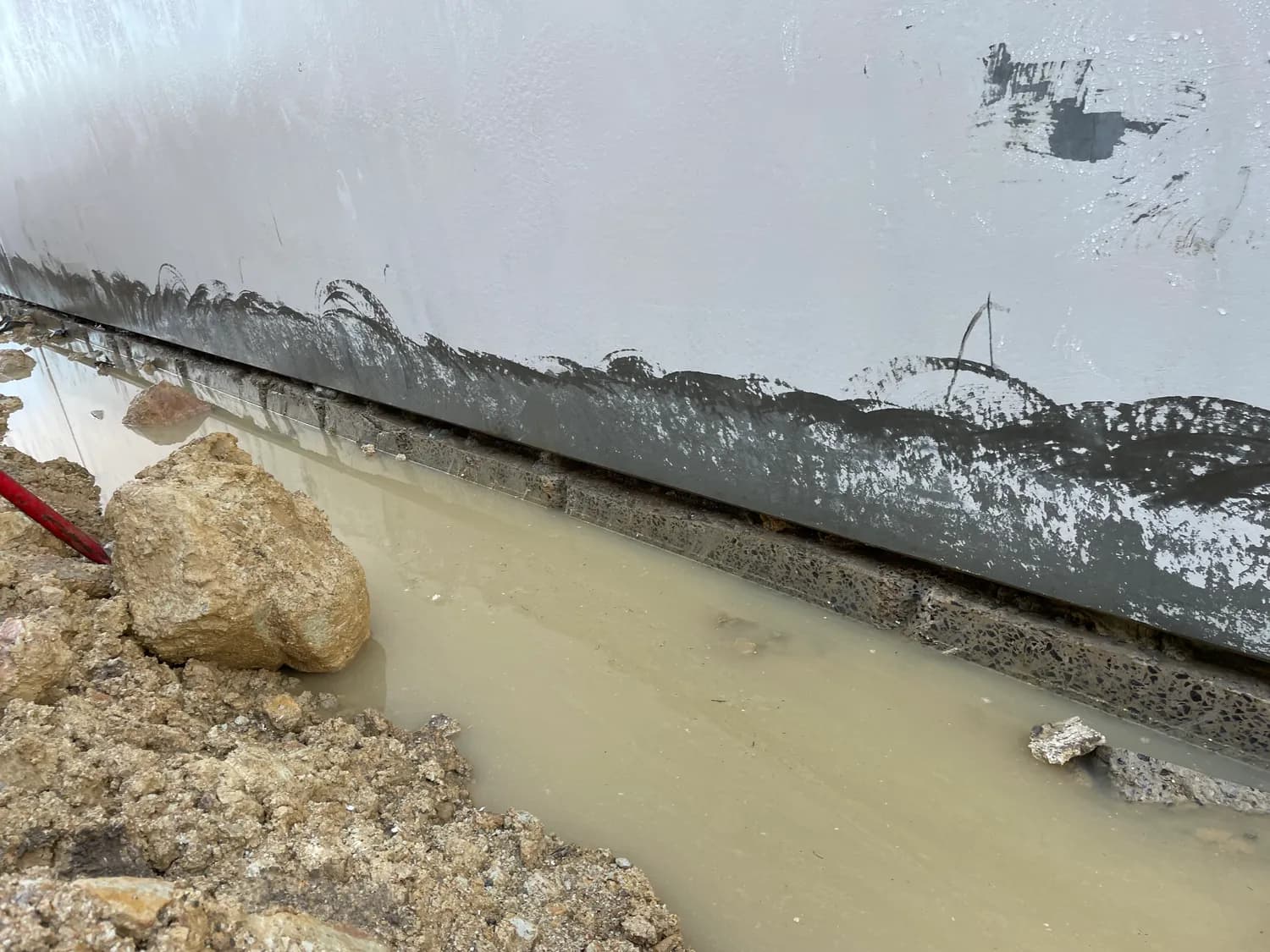 Groundwater penetrating failed tanking in a multi-level basement