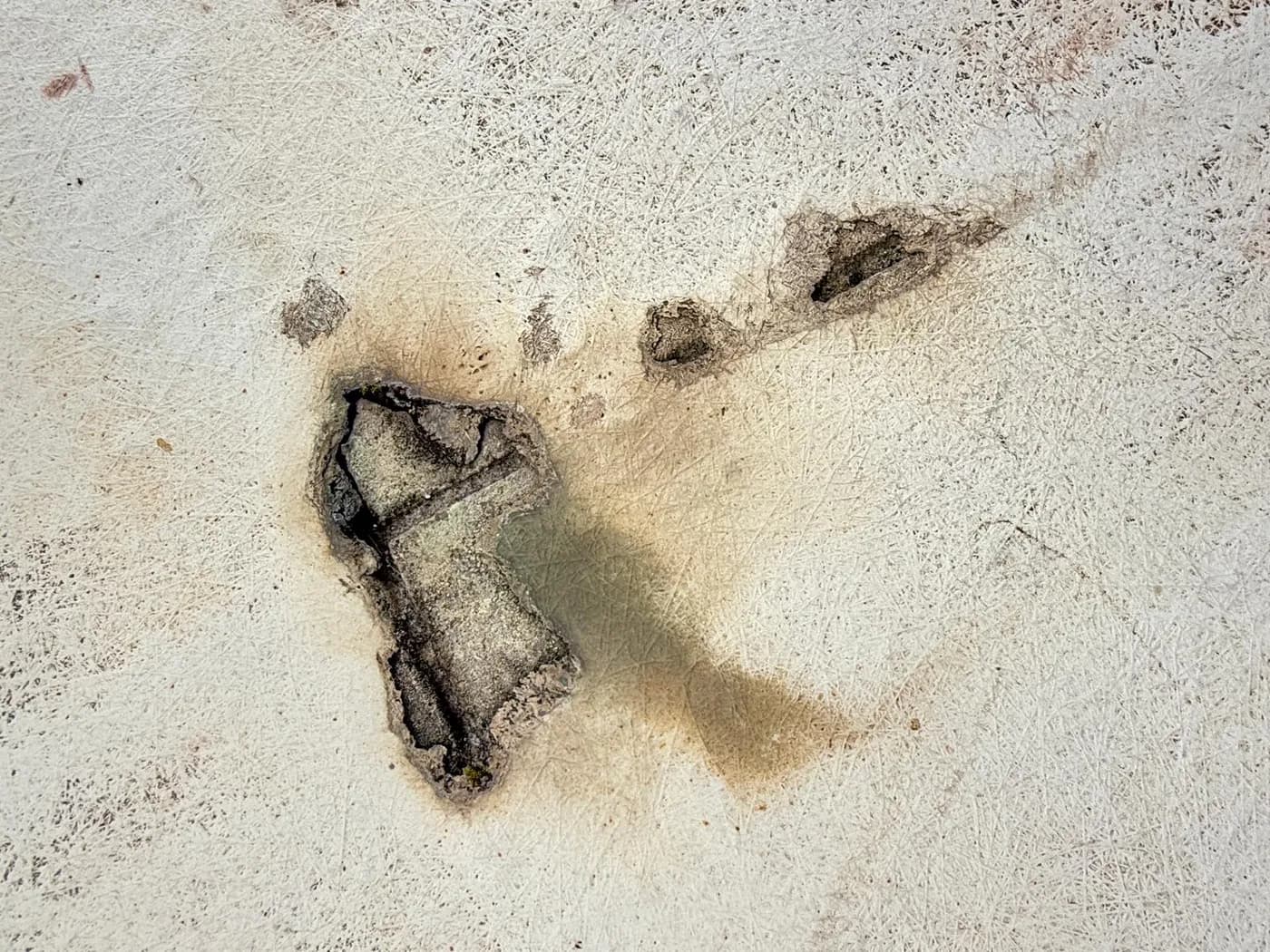 Coating breaches and corrosion across a building facade