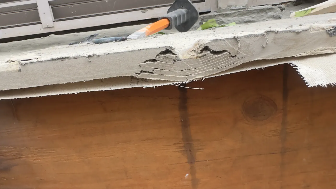 Decayed timber lifting away under the window sill